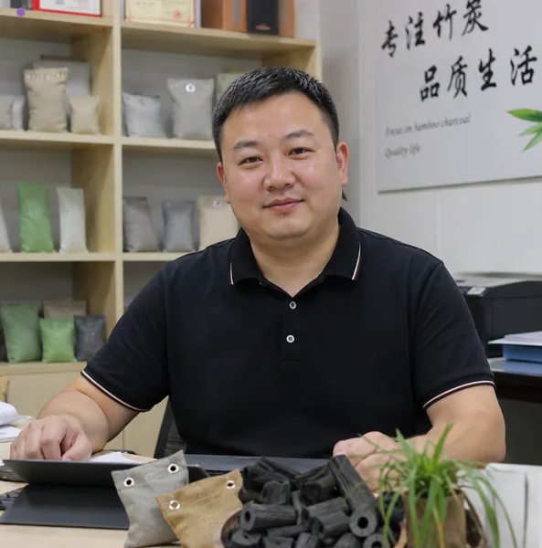 John, founder of BamveraEco, with bamboo charcoal products