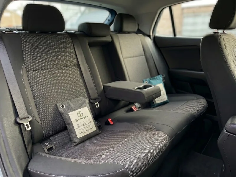 Compact bamboo charcoal odor absorber bags positioned in a vehicle interior